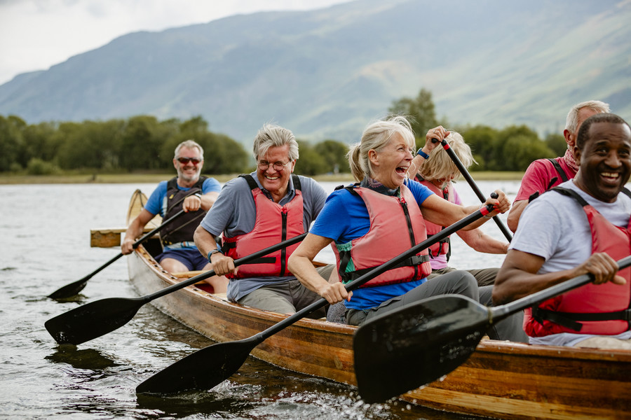 People smiling on a kayak