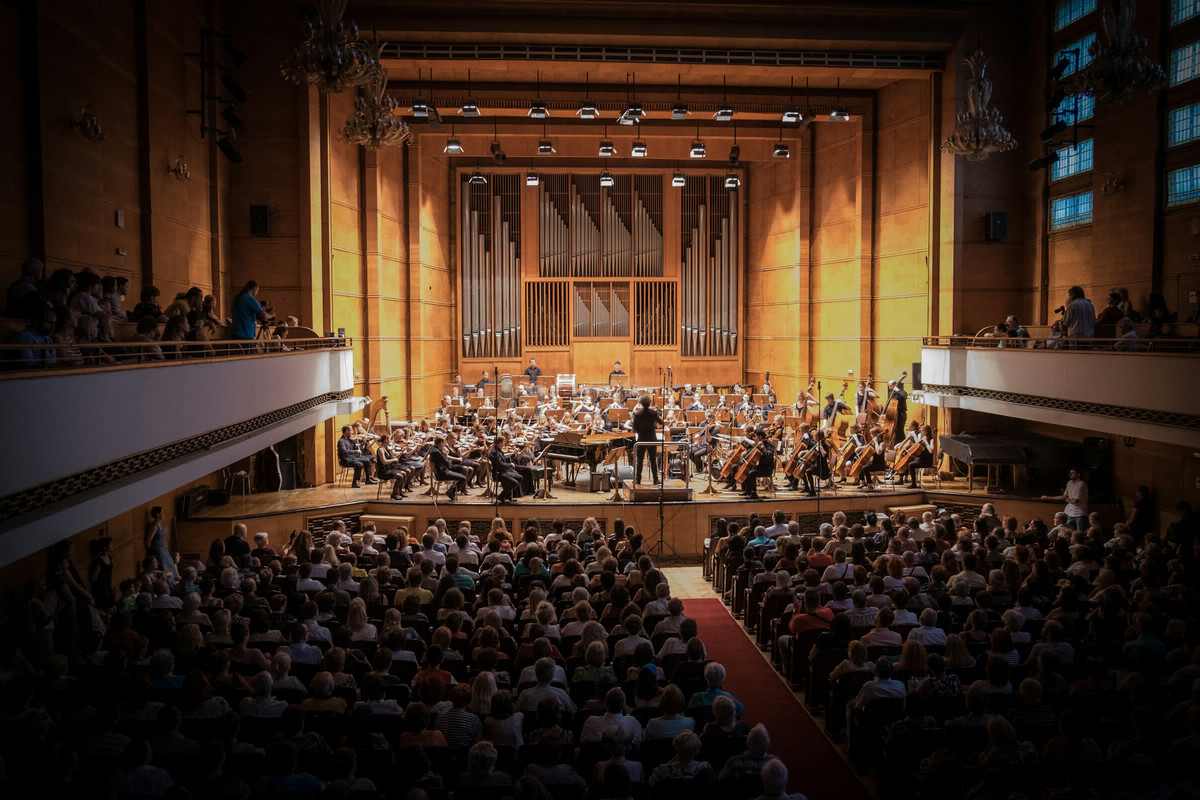 view of a symphony orchestra performing for audience